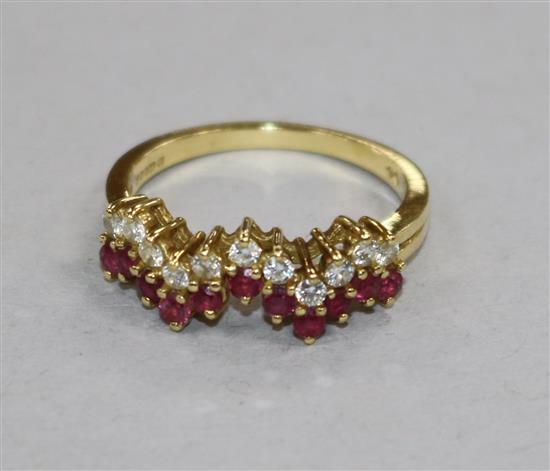 A modern 18ct gold, ruby and diamond half hoop zigzag ring, size N.